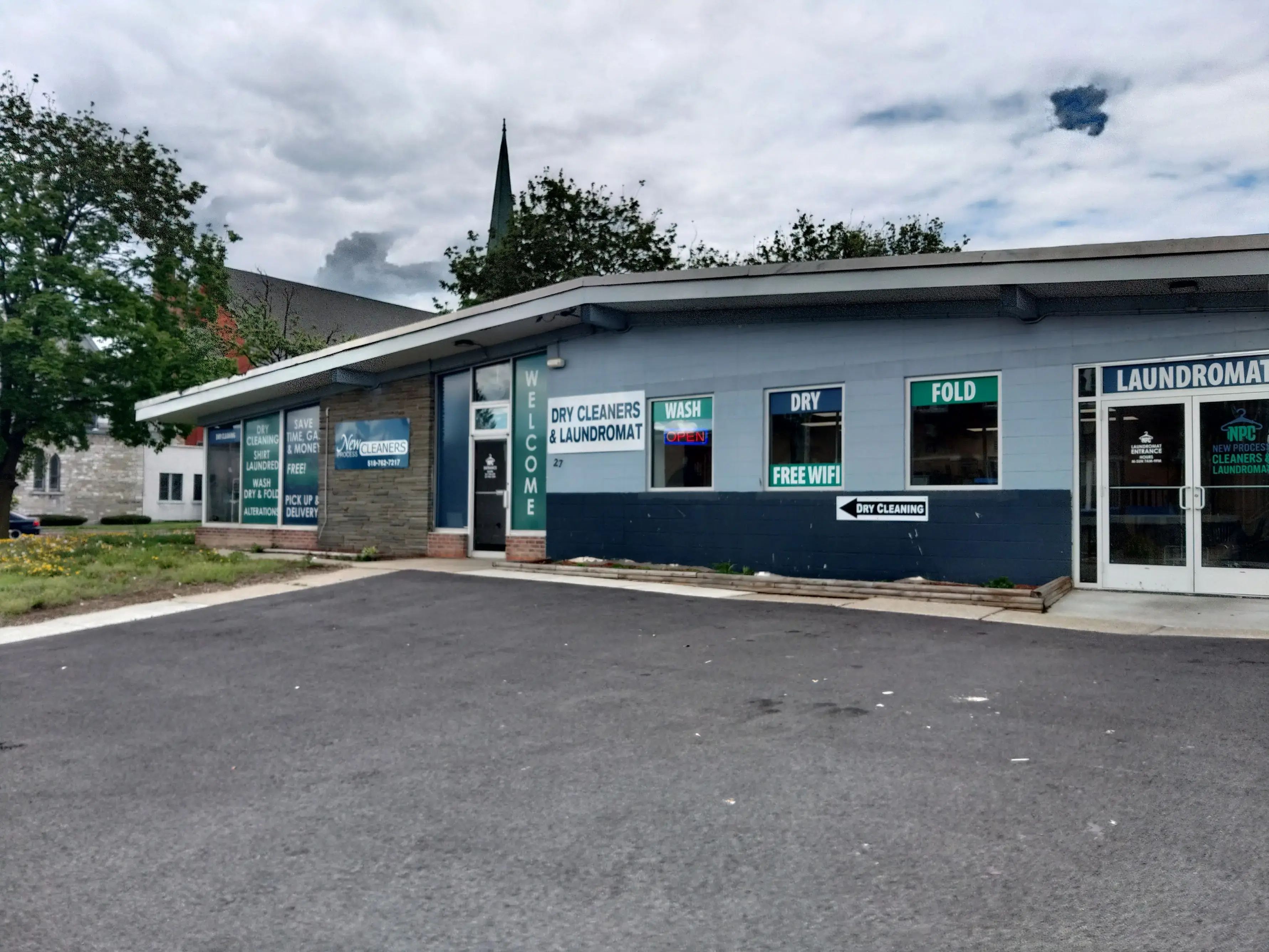 New Process Cleaners & Laundromat - Image 14